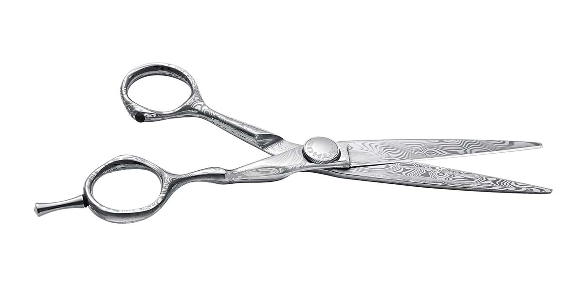 Friseurschere mit Damastmuster.